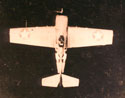 F4F-3P Wildcat flying over jungle terrain