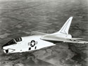 In-flight photograph of John Glenn piloting his F8U-1P Crusader during the "Project Bullet" record breaking transcontinental flight, 1957